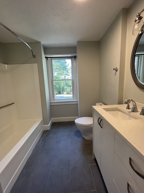 138 High Street Hingham, MA 02043 - Photo 12 of 23 a bathroom with a sink and a large mirror