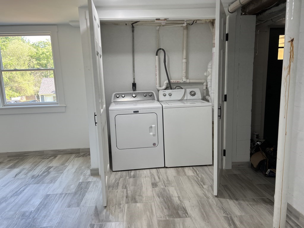 138 High Street Hingham, MA 02043 - Photo 22 of 23 a view of storage and utility room with a washer and dryer