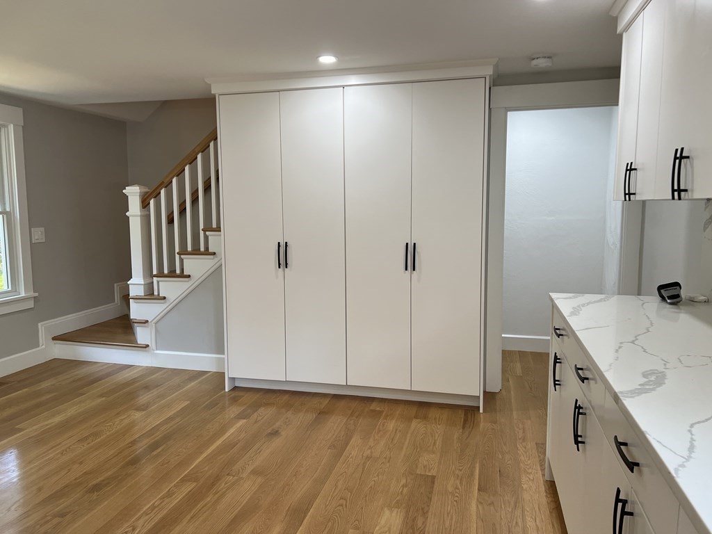 138 High Street Hingham, MA 02043 - Photo 4 of 23 a view of hallway with stairs and wooden floor