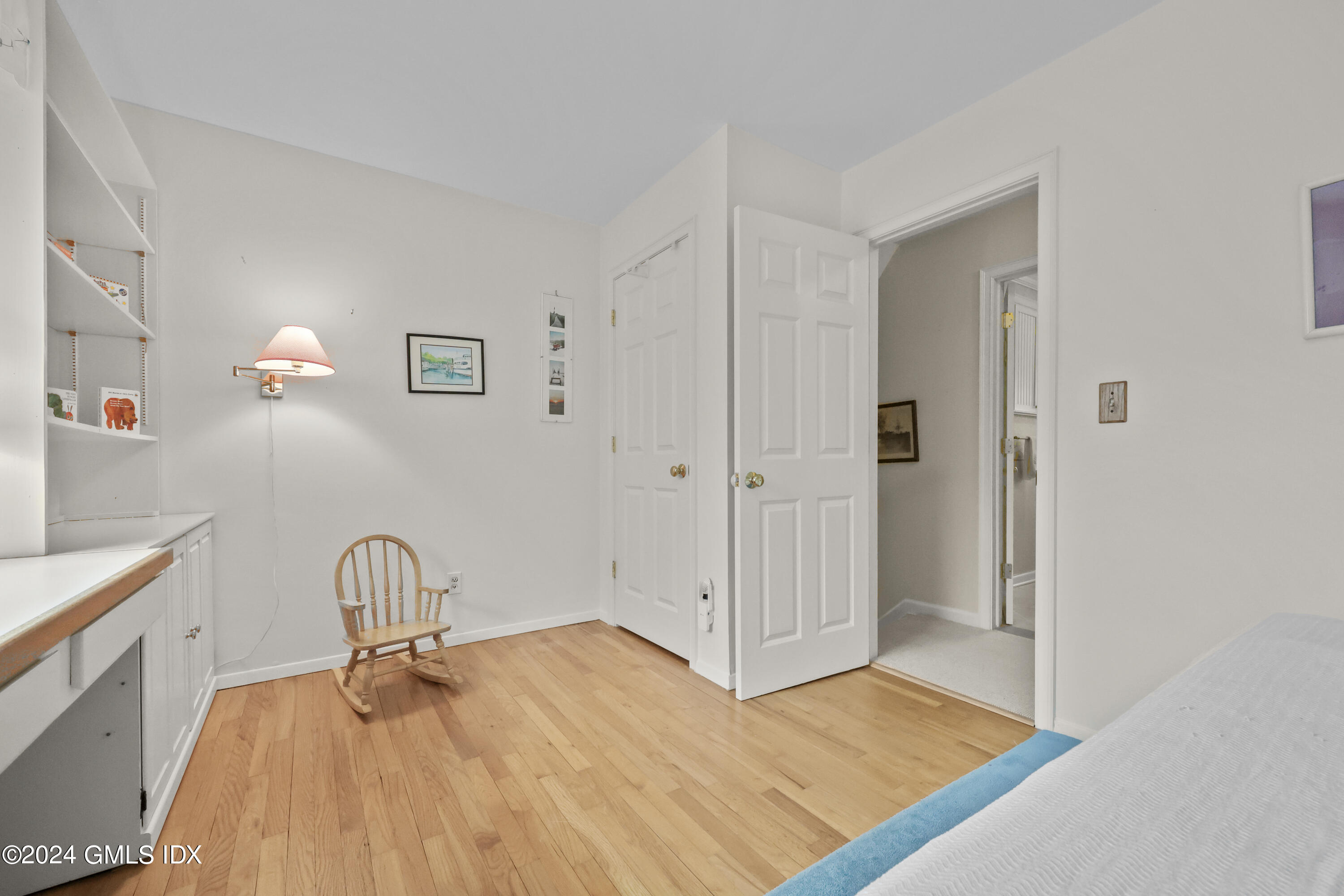 28 Dandy Drive Cos Cob, CT 06807 - Photo 12 of 24 a room that has a bed and a table in it