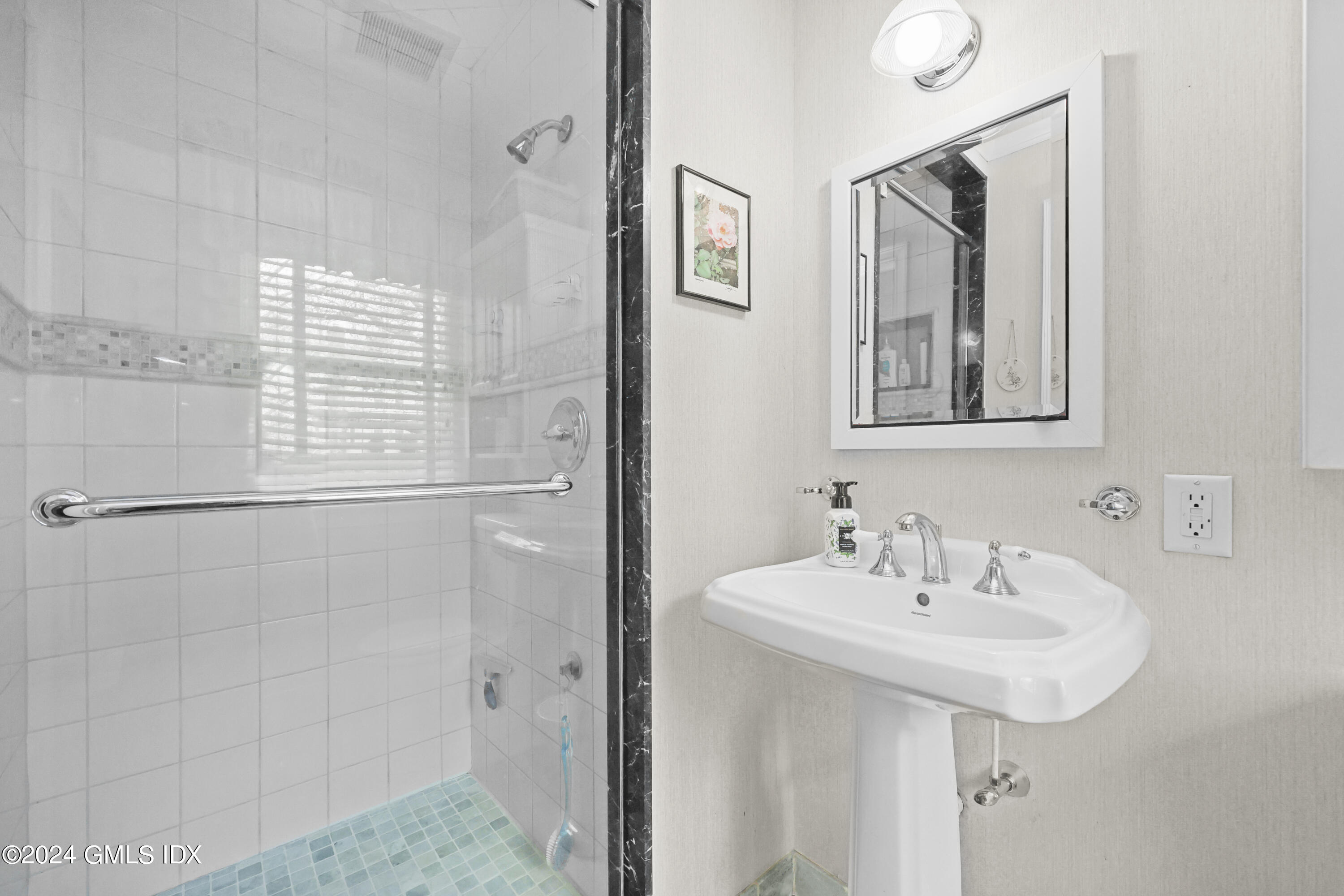 28 Dandy Drive Cos Cob, CT 06807 - Photo 15 of 24 a bathroom with a sink and a mirror