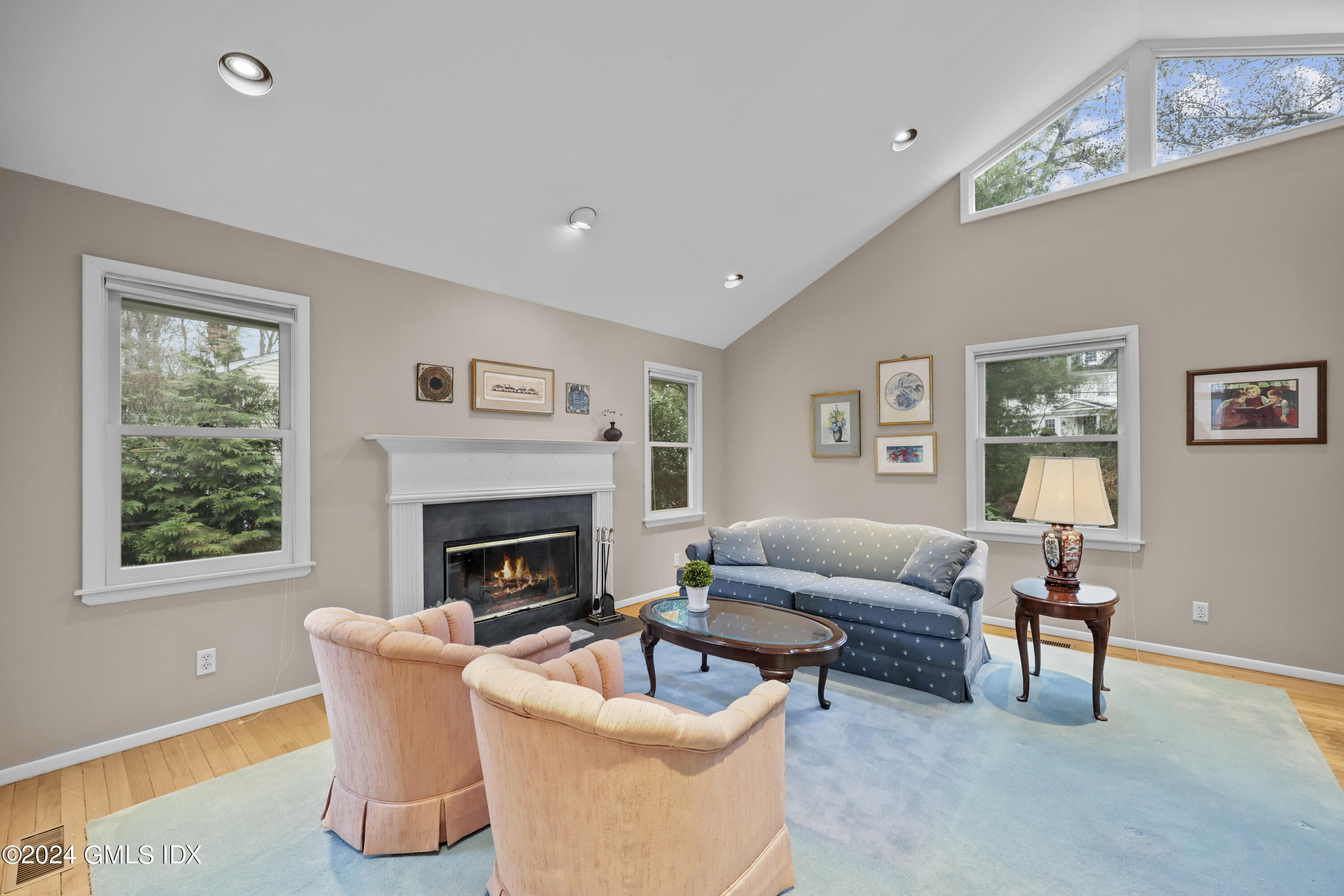 28 Dandy Drive Cos Cob, CT 06807 - Photo 3 of 24 a living room with furniture a fireplace and a window