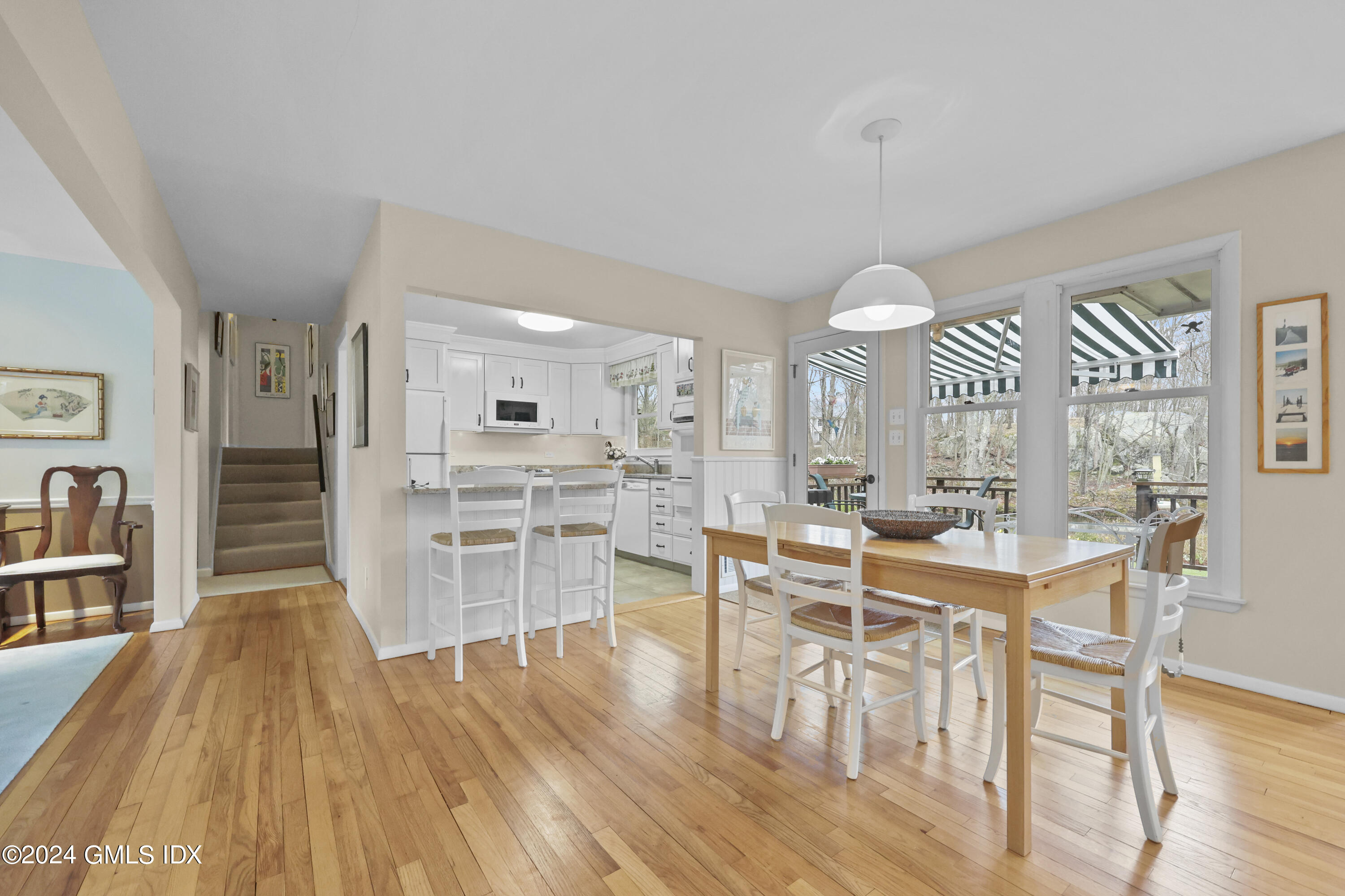 28 Dandy Drive Cos Cob, CT 06807 - Photo 7 of 24 a view of a dining room with furniture and wooden floor