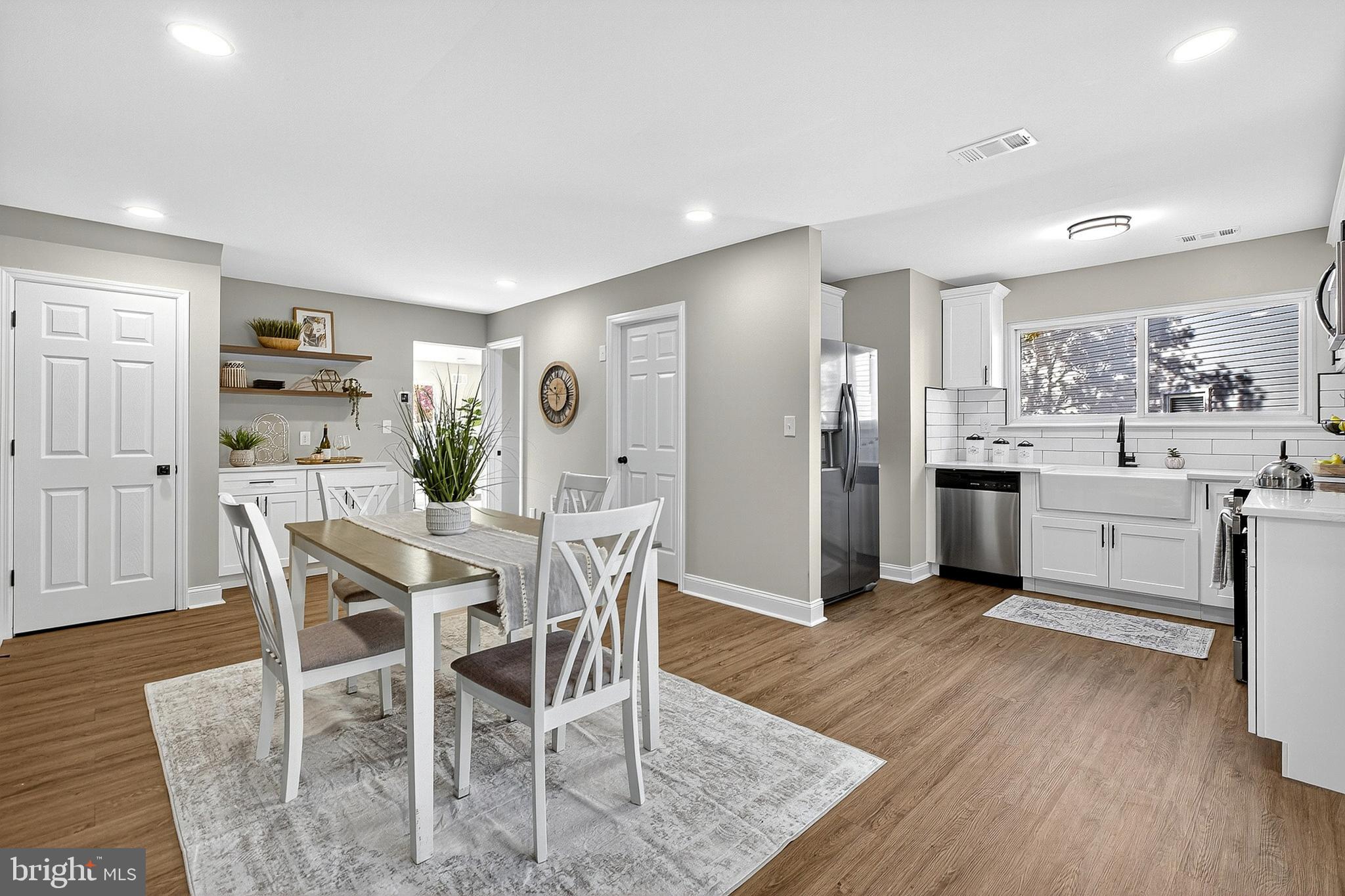 4 Corvas Court Sewell, NJ 08080 - Photo 16 of 40 a kitchen with stainless steel appliances kitchen island granite countertop a table chairs and a refrigerator