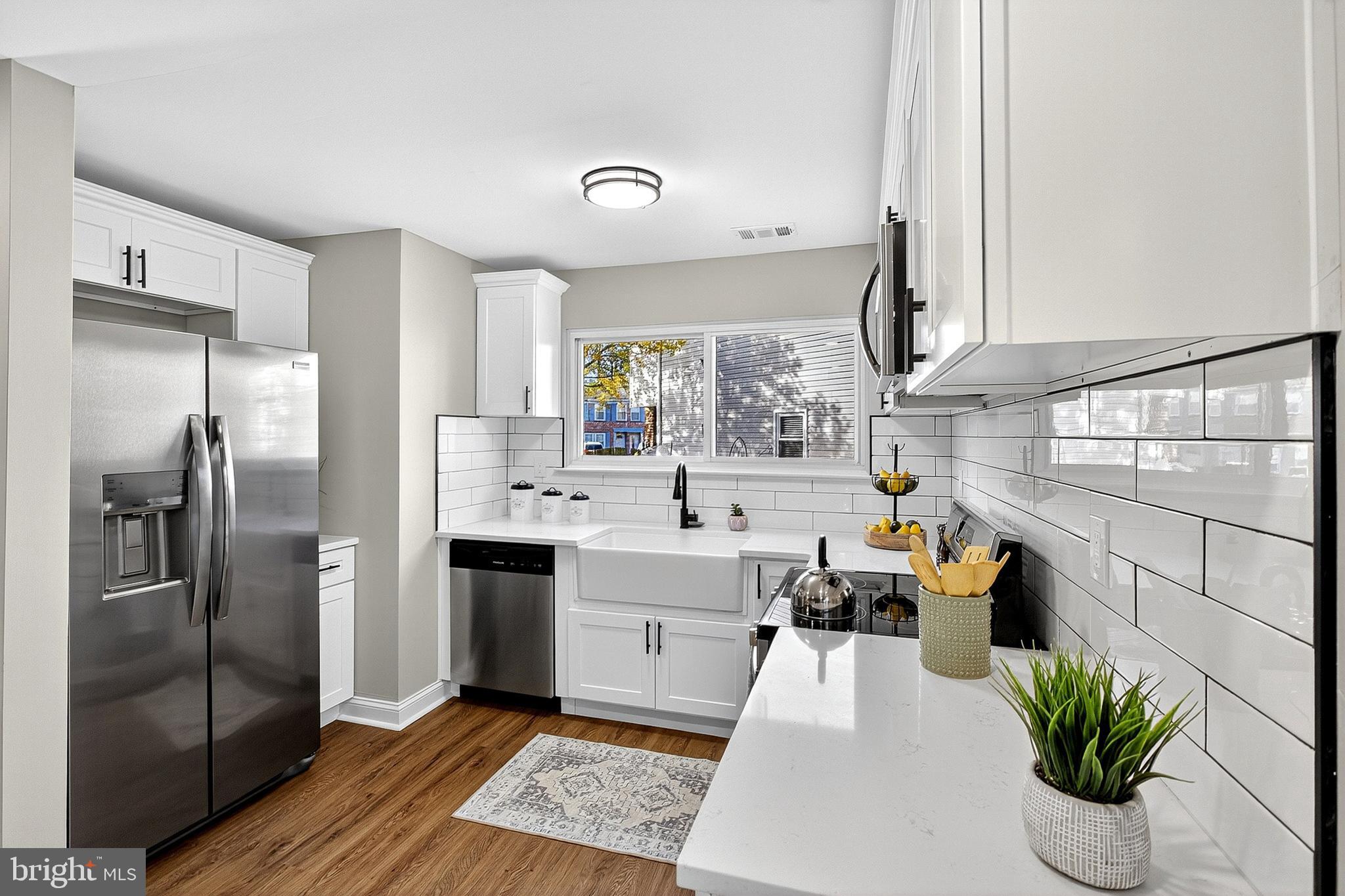 4 Corvas Court Sewell, NJ 08080 - Photo 20 of 40 a large kitchen with stainless steel appliances kitchen island granite countertop a refrigerator a sink a stove and a refrigerator