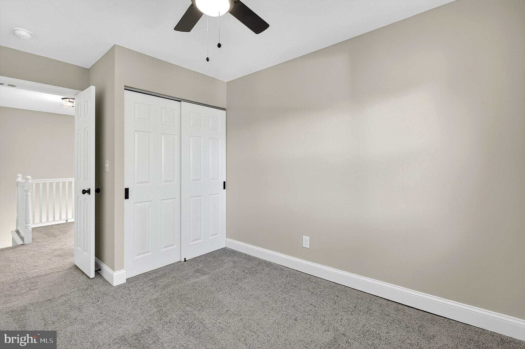 4 Corvas Court Sewell, NJ 08080 - Photo 23 of 40 an empty room with a ceiling fan and carpet