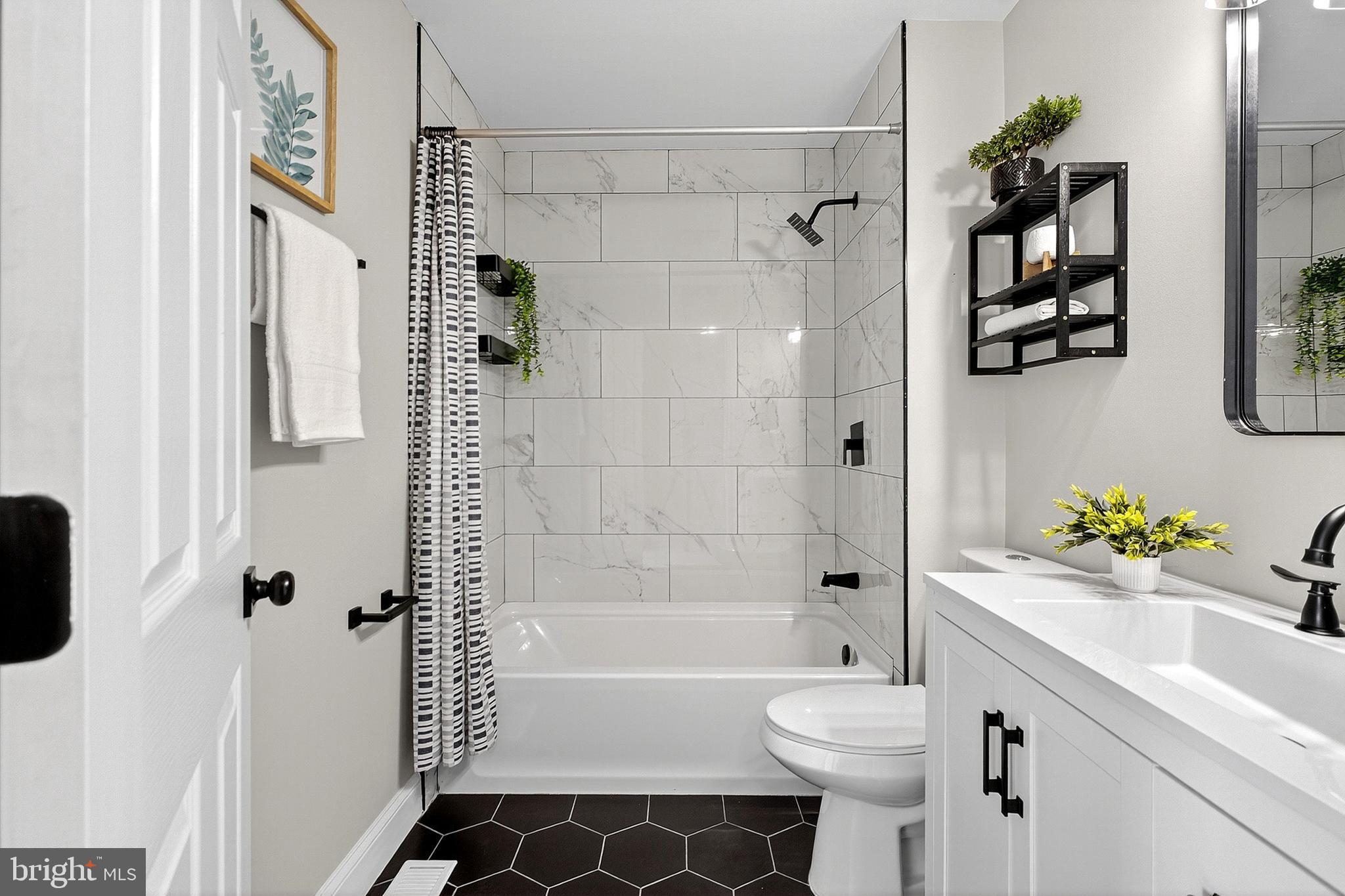 4 Corvas Court Sewell, NJ 08080 - Photo 28 of 40 a bathroom with a sink a toilet and shower