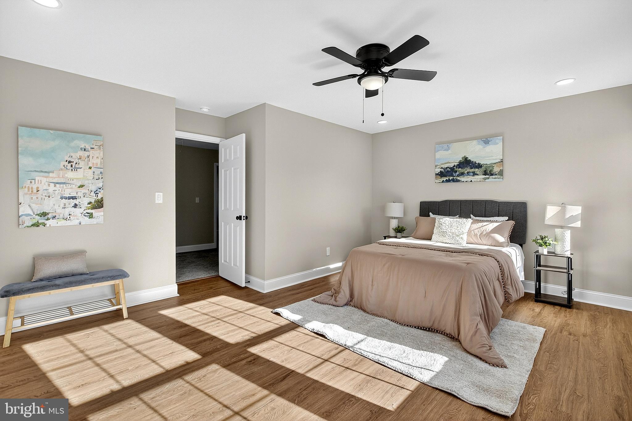 4 Corvas Court Sewell, NJ 08080 - Photo 34 of 40 a bedroom with a large bed and a chandelier