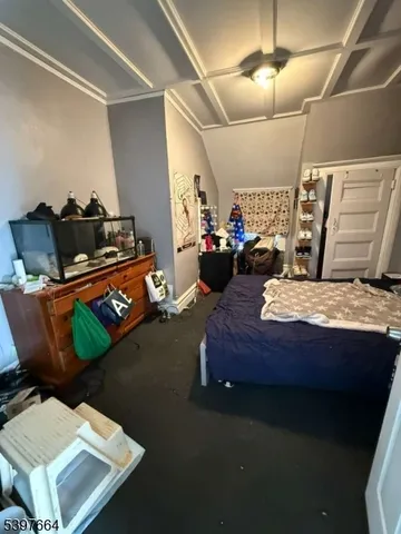 a bed room with furniture and a chandelier