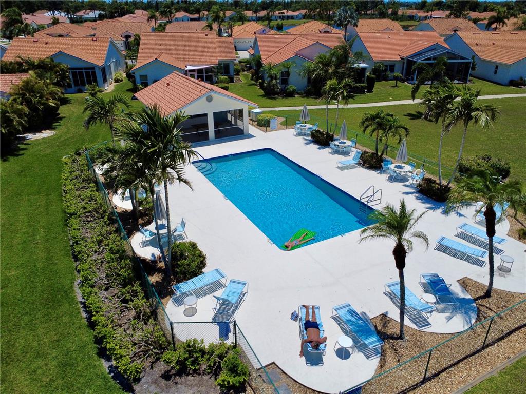 4266 Summertree Road Venice, FL 34293 - Photo 45 of 64 an aerial view of a house with garden space and lake view