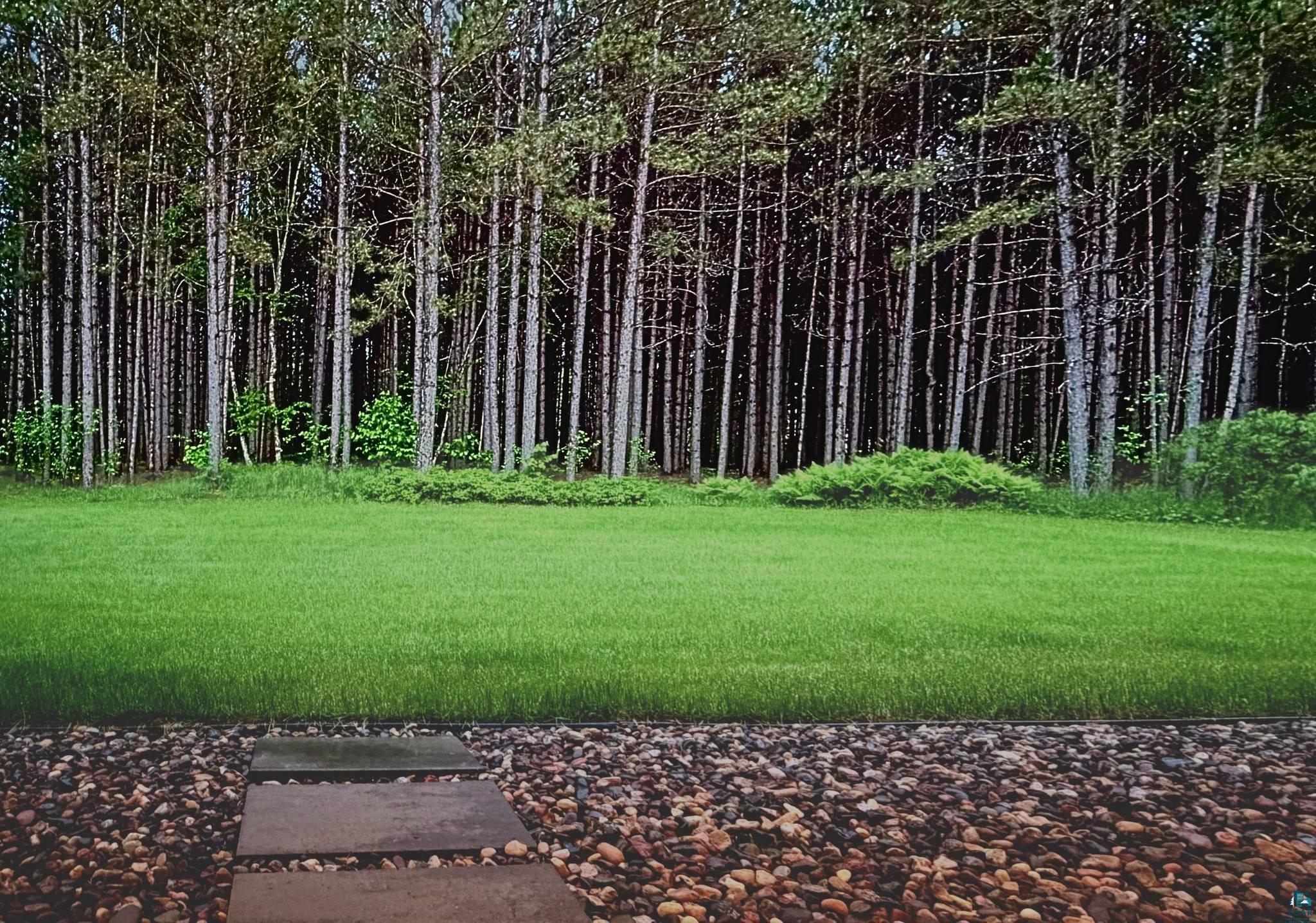 41 East Stark Road Esko, MN 55733 - Photo 4 of 5 Expansive lawn bordered by mature trees and natural landscaping