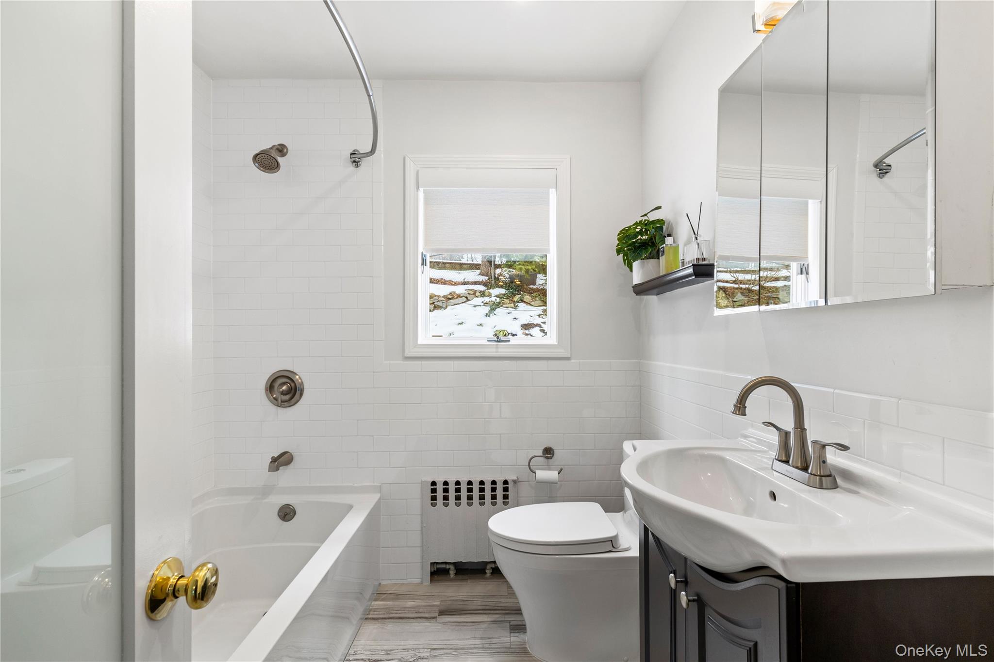 24 Old Well Road Purchase, NY 10577 - Photo 22 of 37 a bathroom with a sink a toilet and bathtub