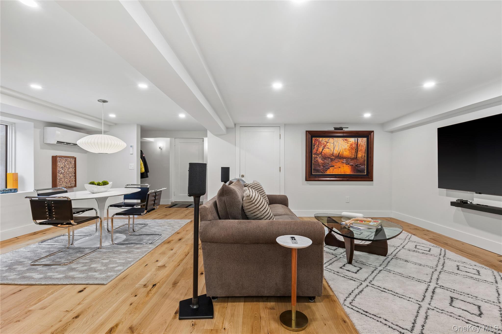 24 Old Well Road Purchase, NY 10577 - Photo 25 of 37 a living room with furniture and a flat screen tv