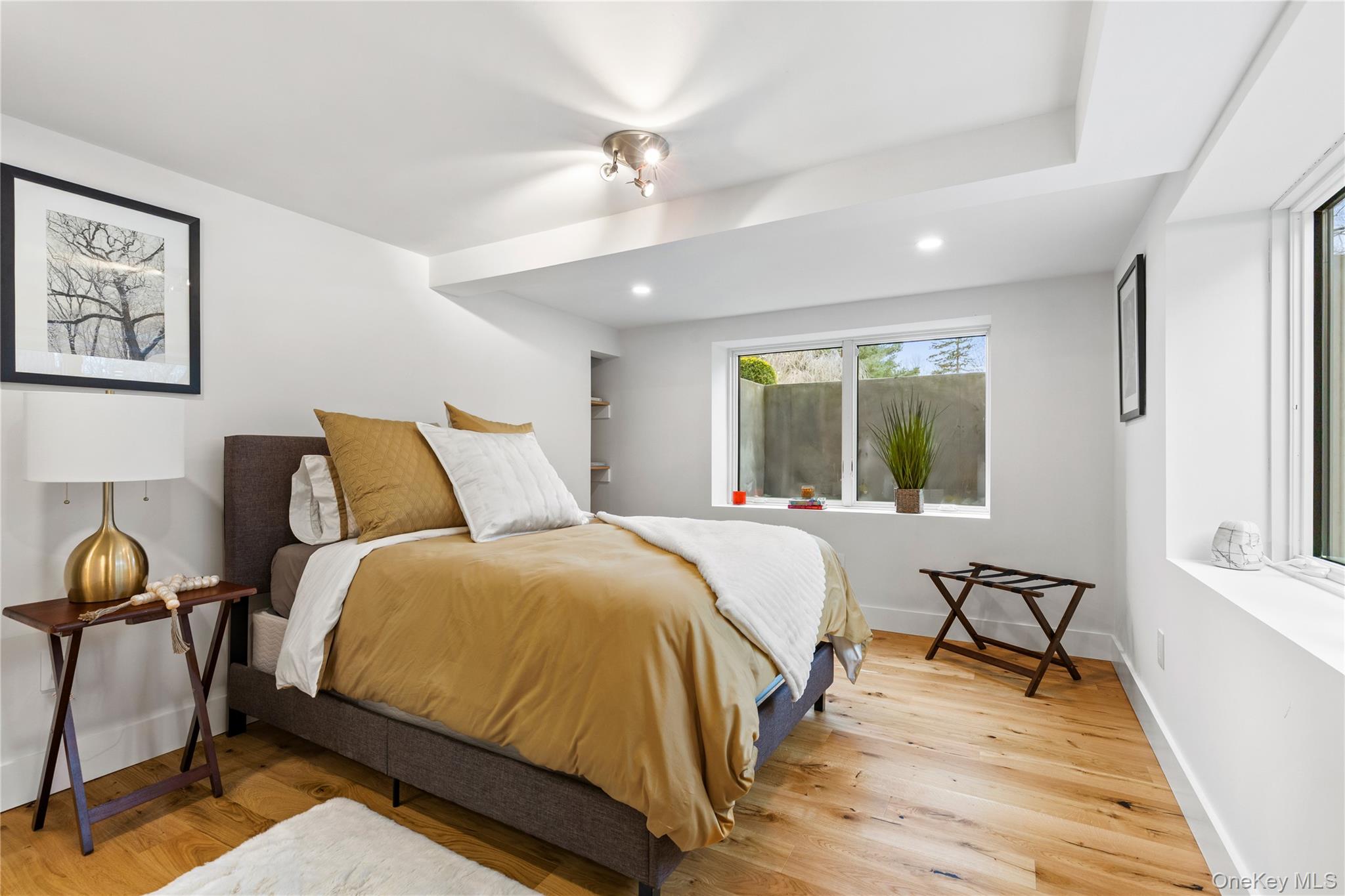 24 Old Well Road Purchase, NY 10577 - Photo 29 of 37 a bedroom with a bed and a window