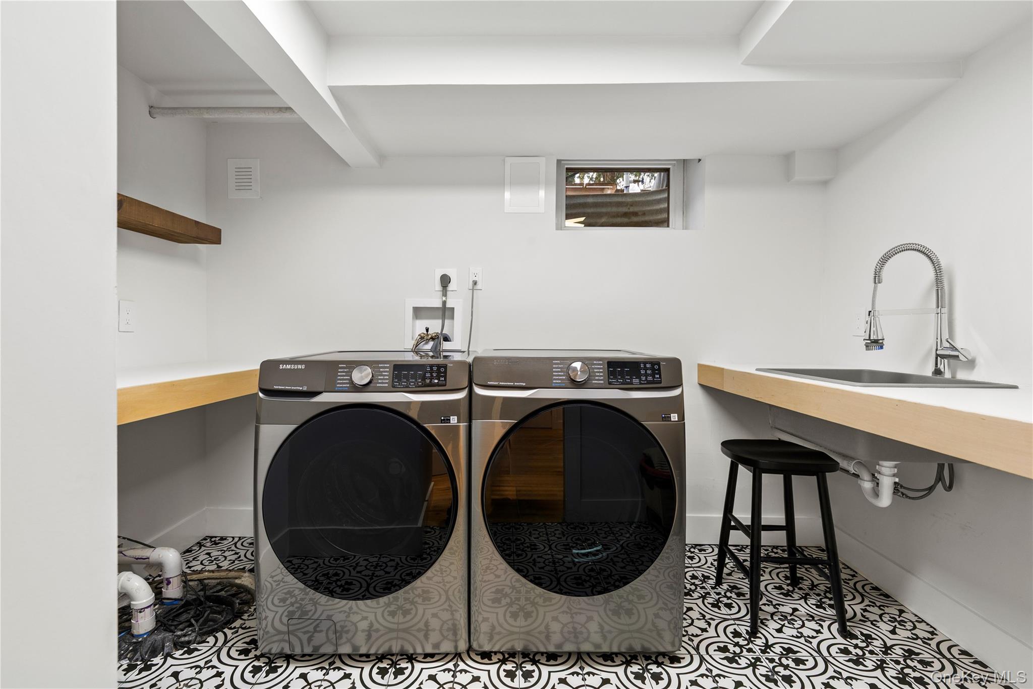 24 Old Well Road Purchase, NY 10577 - Photo 32 of 37 a utility room with sink dryer and washer