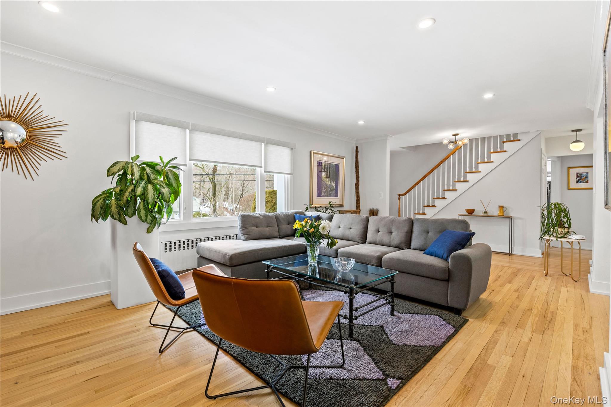 24 Old Well Road Purchase, NY 10577 - Photo 4 of 37 a living room with furniture potted plant and a wooden floor