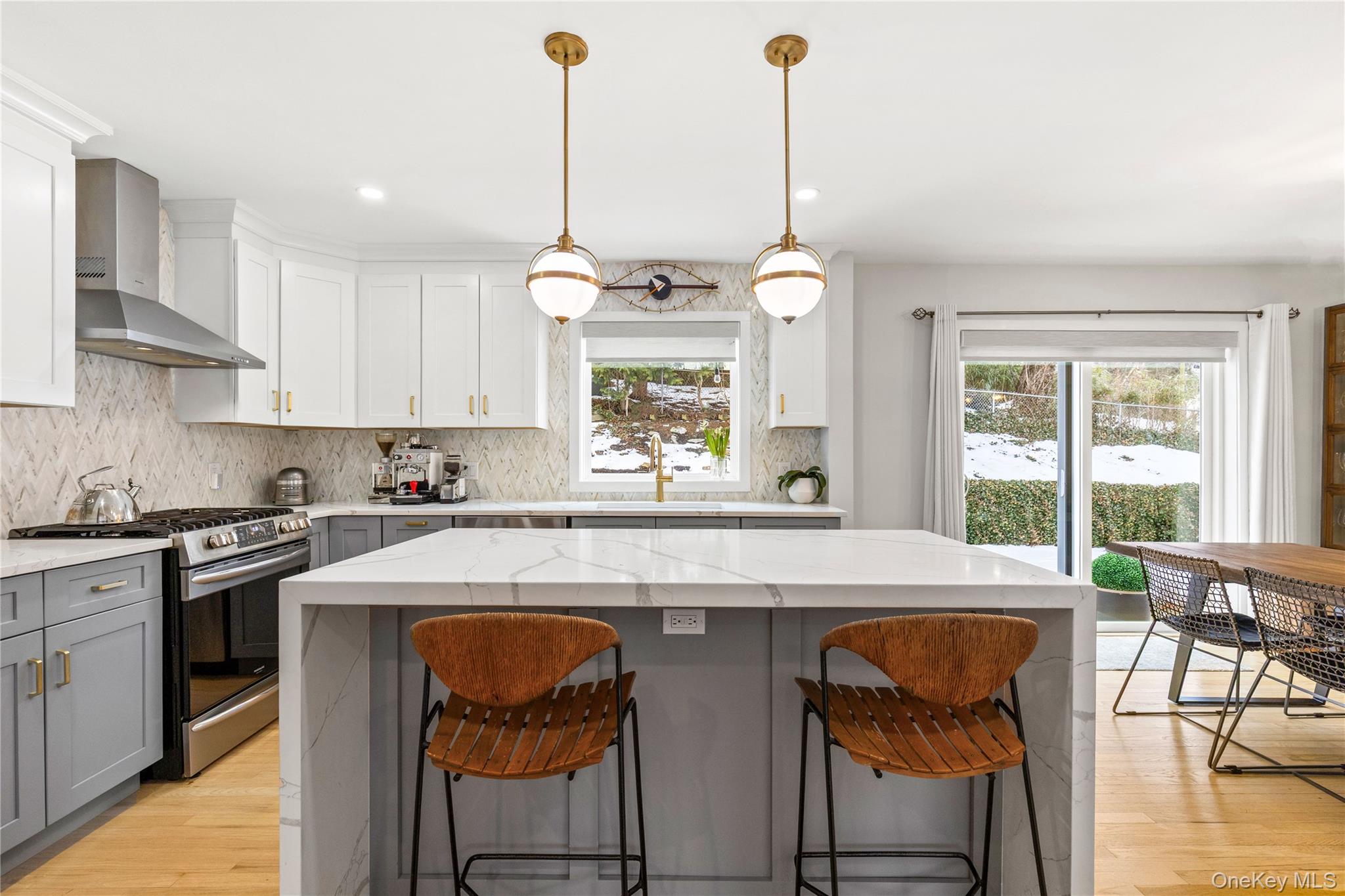 24 Old Well Road Purchase, NY 10577 - Photo 7 of 37 a kitchen with stainless steel appliances granite countertop a stove a sink dishwasher and white cabinets with wooden floor