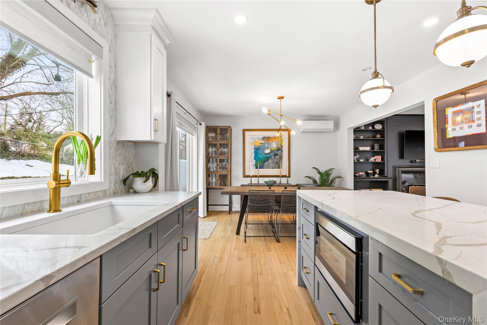 24 Old Well Road Purchase, NY 10577 - Photo 10 of 37 a kitchen with stainless steel appliances granite countertop a sink stove and wooden floor