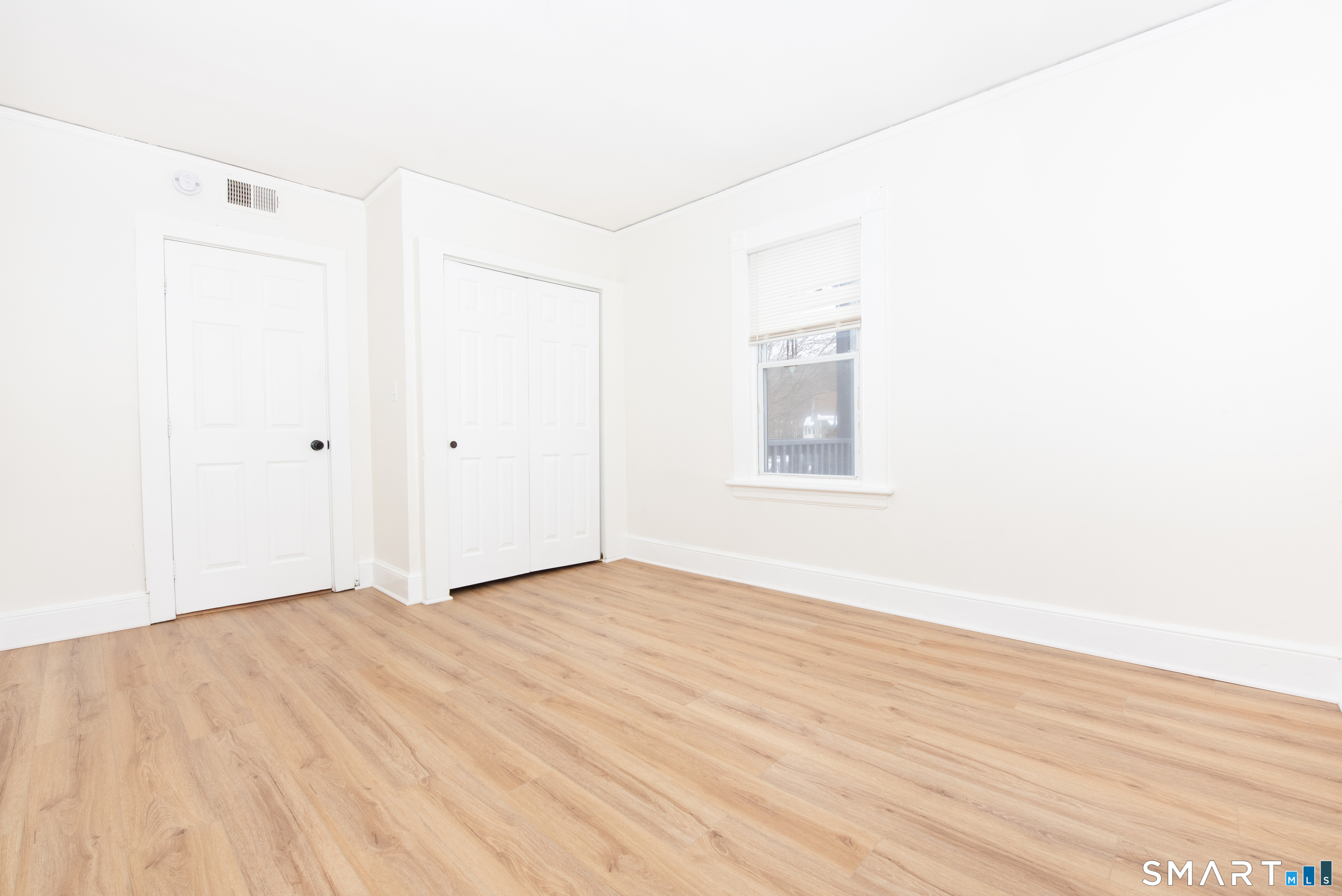 110 Beaver Street Ansonia, CT 06401 - Photo 12 of 30 a view of an empty room with wooden floor
