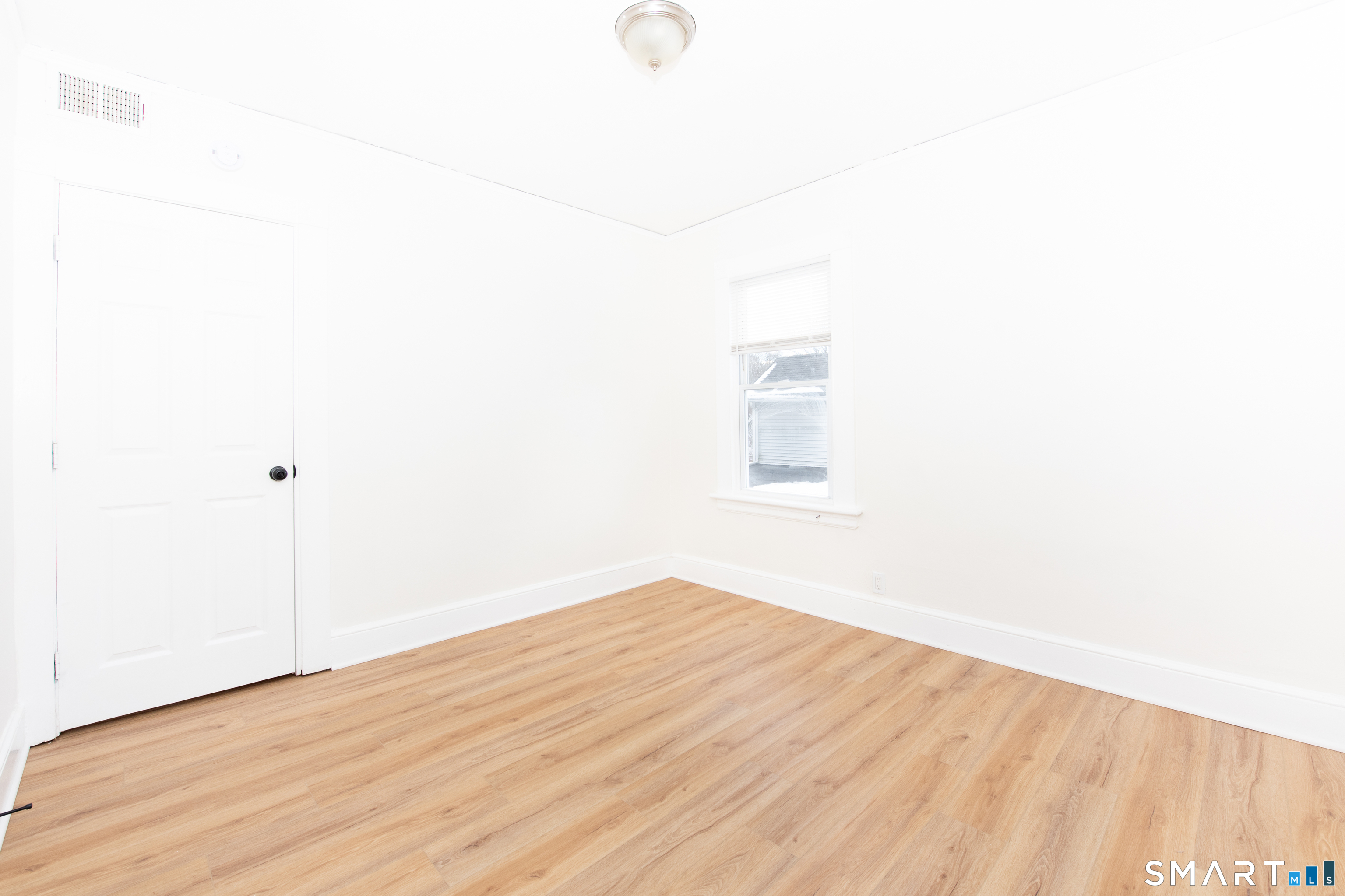 110 Beaver Street Ansonia, CT 06401 - Photo 16 of 30 a view of empty room with wooden floor