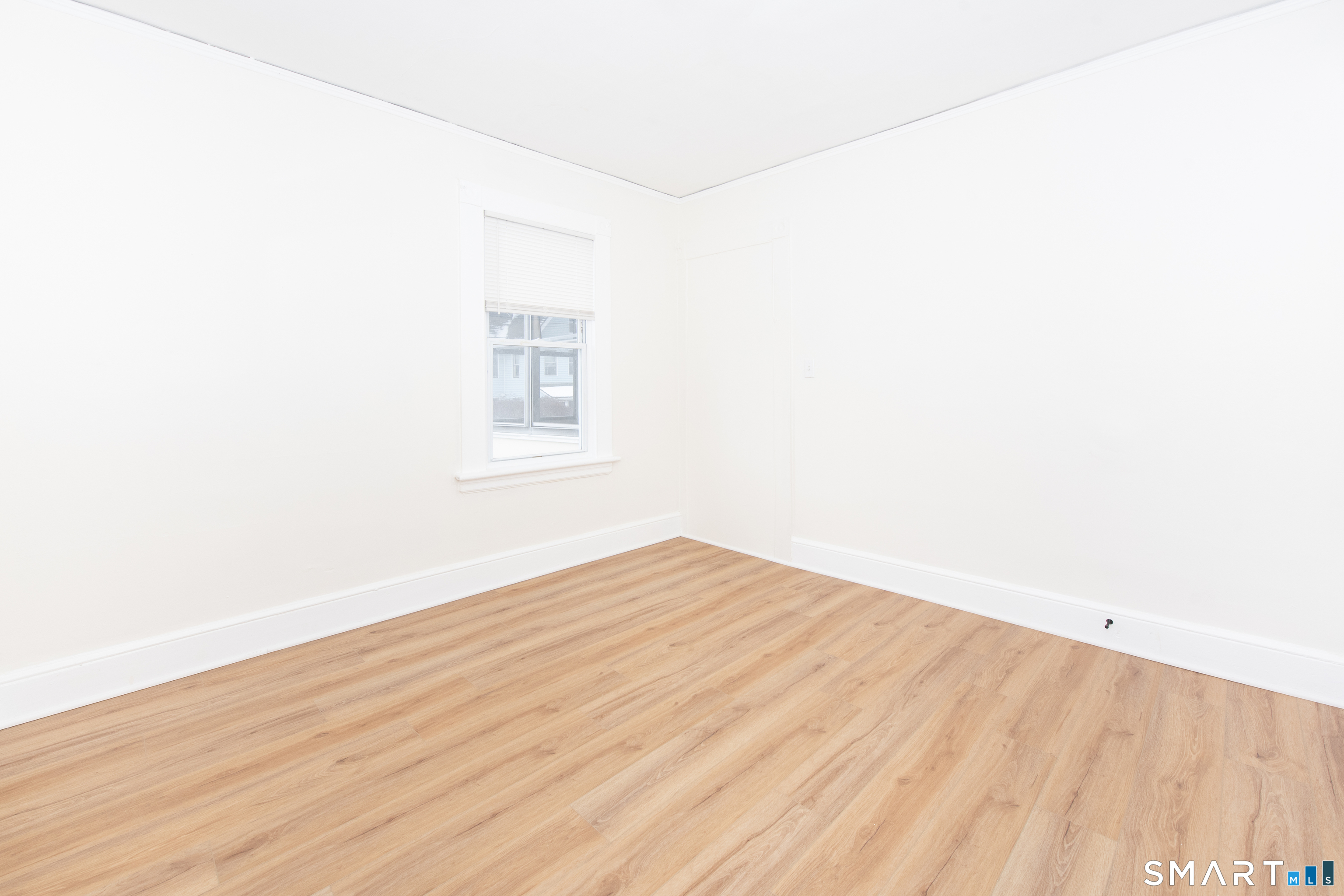 110 Beaver Street Ansonia, CT 06401 - Photo 17 of 30 a view of an empty room with wooden floor
