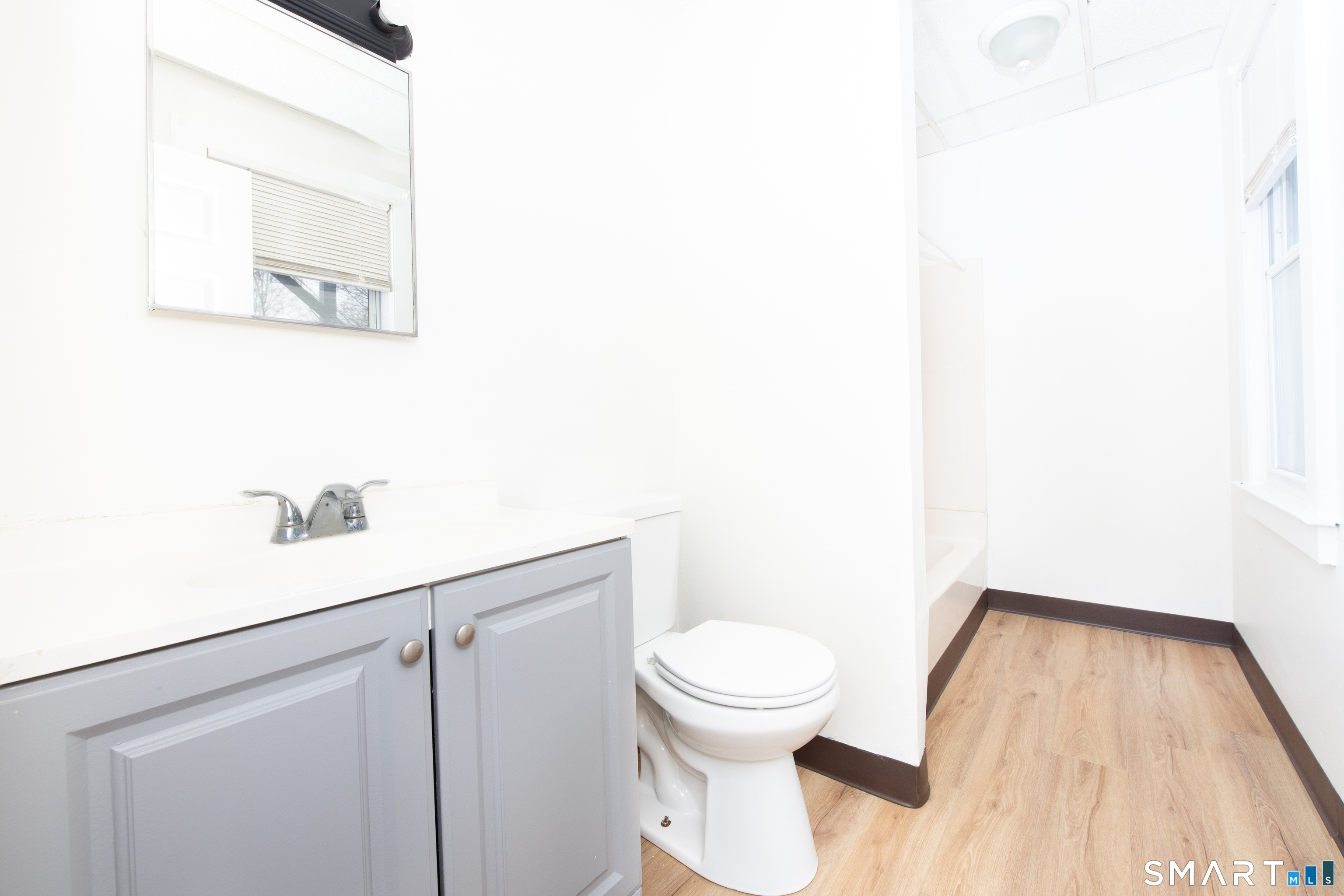 110 Beaver Street Ansonia, CT 06401 - Photo 19 of 30 a bathroom with a toilet and a mirror