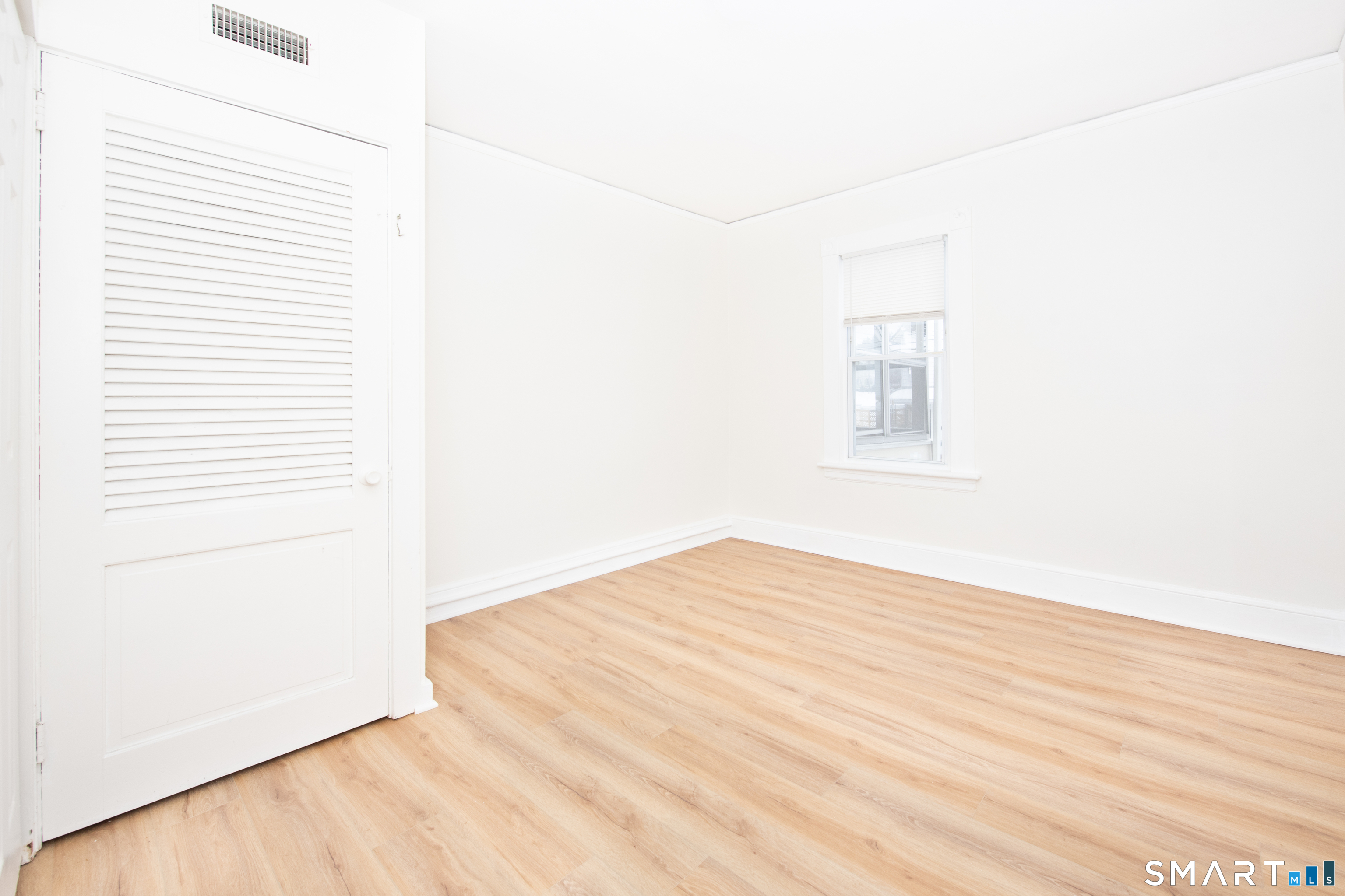 110 Beaver Street Ansonia, CT 06401 - Photo 24 of 30 a view of empty room with wooden floor