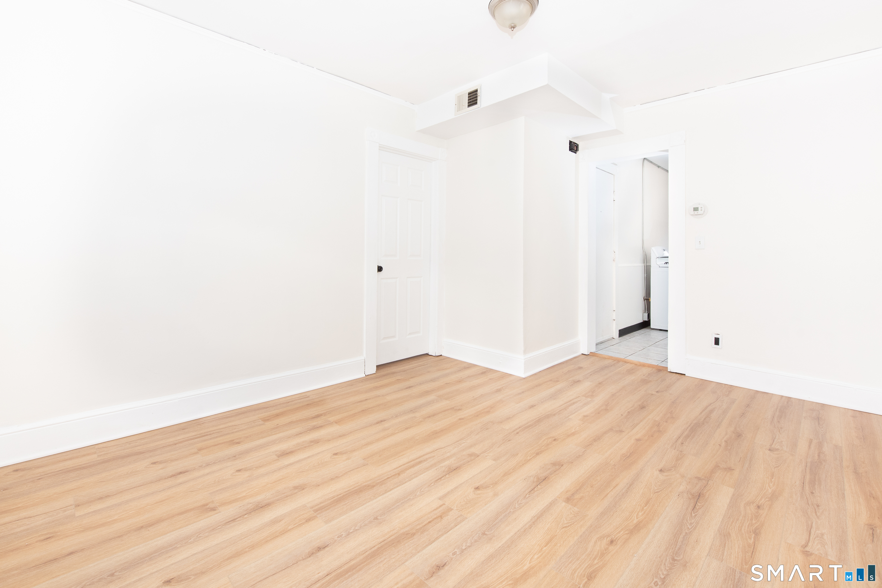 110 Beaver Street Ansonia, CT 06401 - Photo 9 of 30 a view of empty room with wooden floor