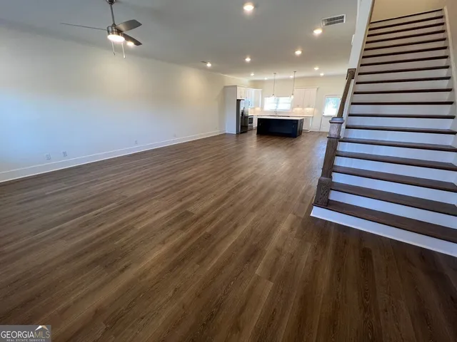 an empty room with wooden floor