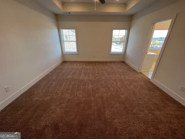 a view of empty room with windows