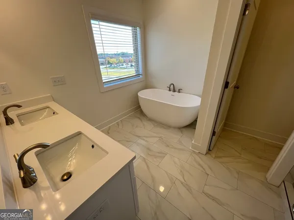 a bathroom with a sink and bathtub