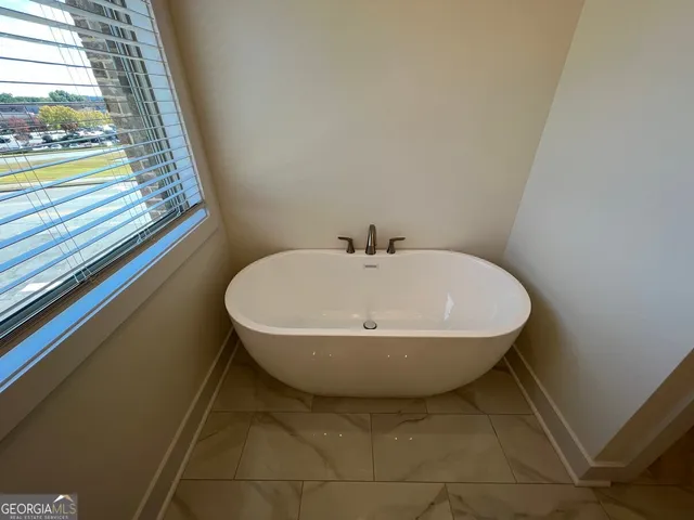 a bathroom with a shower and a toilet
