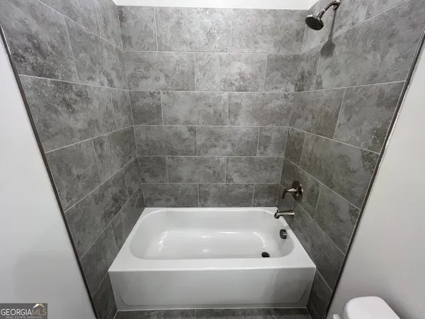 a view of a hallway with staircase