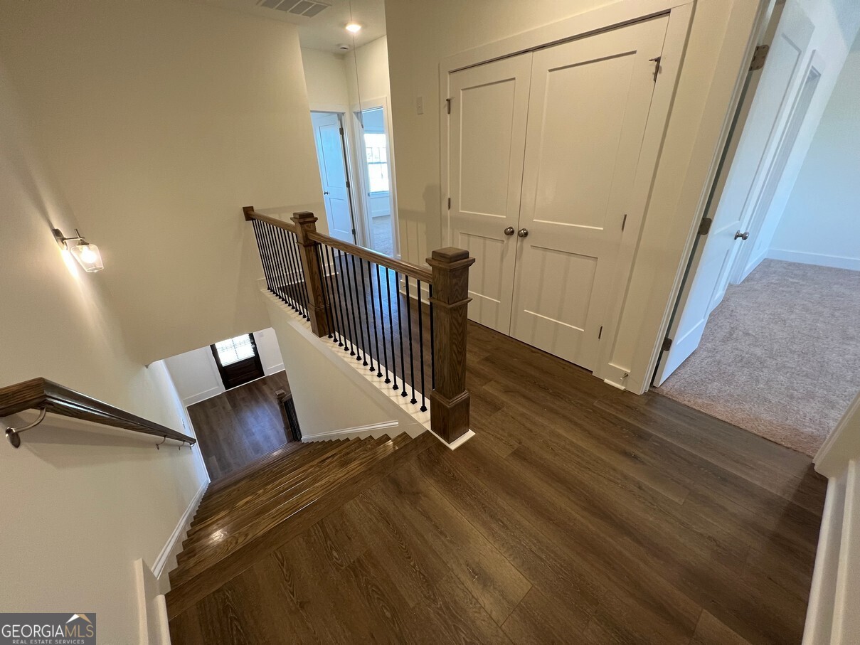 899 Duck Walk Way Lawrenceville, GA 30046 - Photo 40 of 49 a view of a hallway with staircase