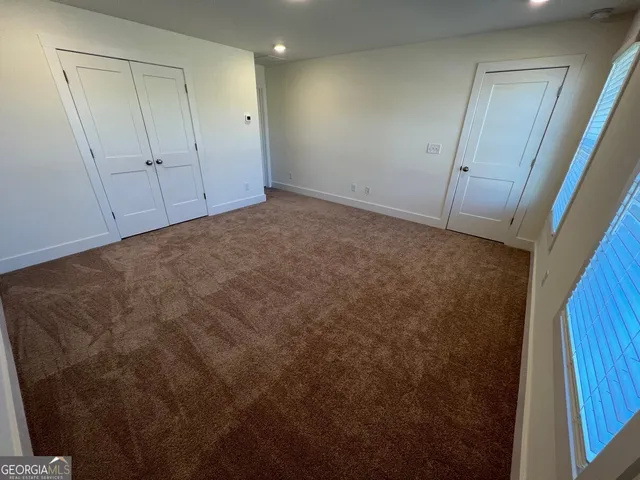 a view of a balcony with wooden floor