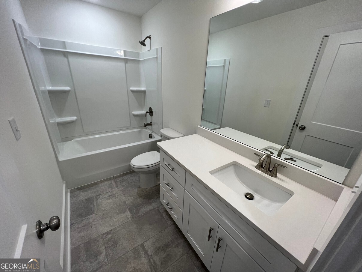 899 Duck Walk Way Lawrenceville, GA 30046 - Photo 45 of 49 a bathroom with a sink a toilet and shower