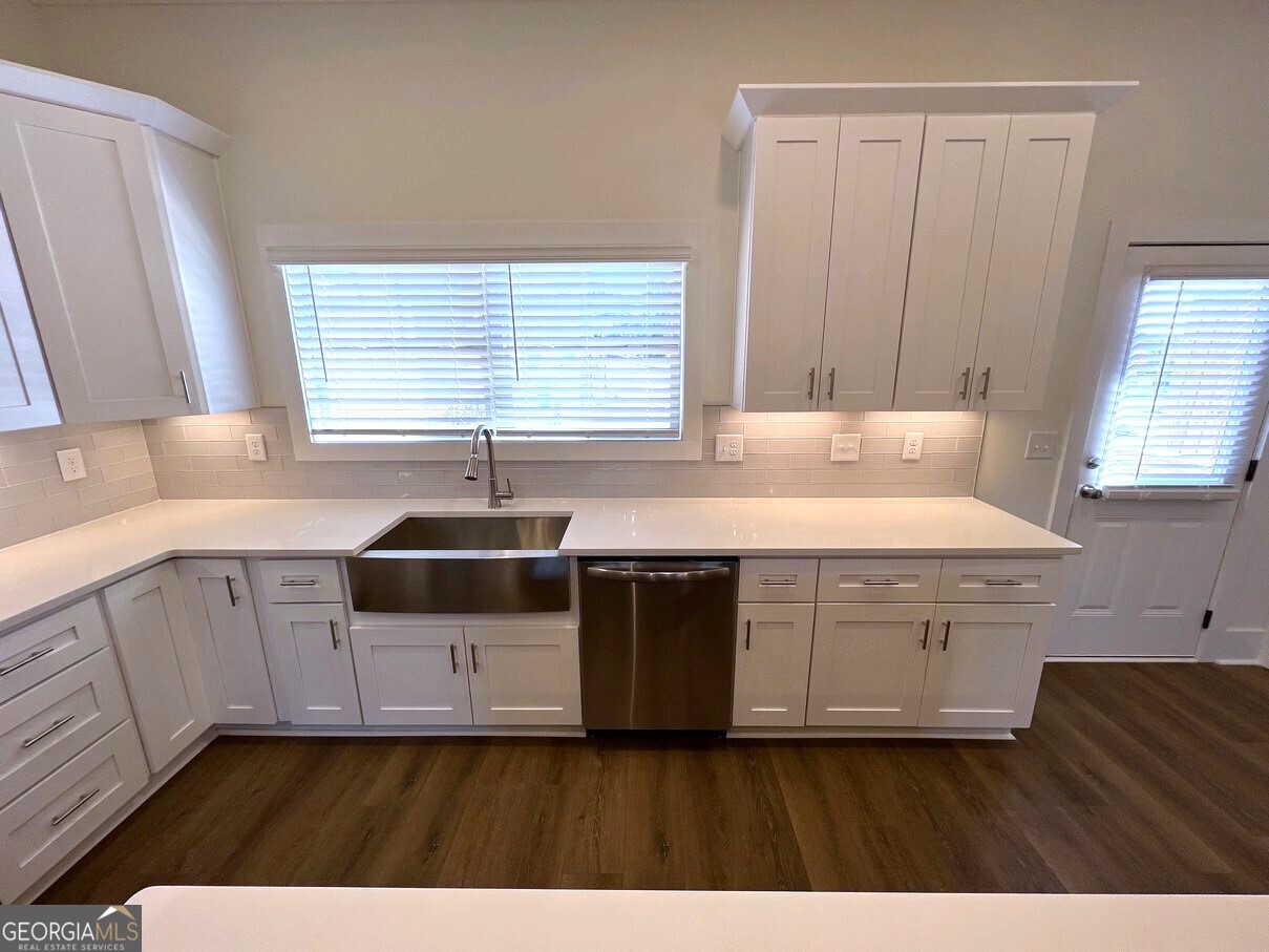 899 Duck Walk Way Lawrenceville, GA 30046 - Photo 10 of 49 a kitchen with a sink stove and cabinets