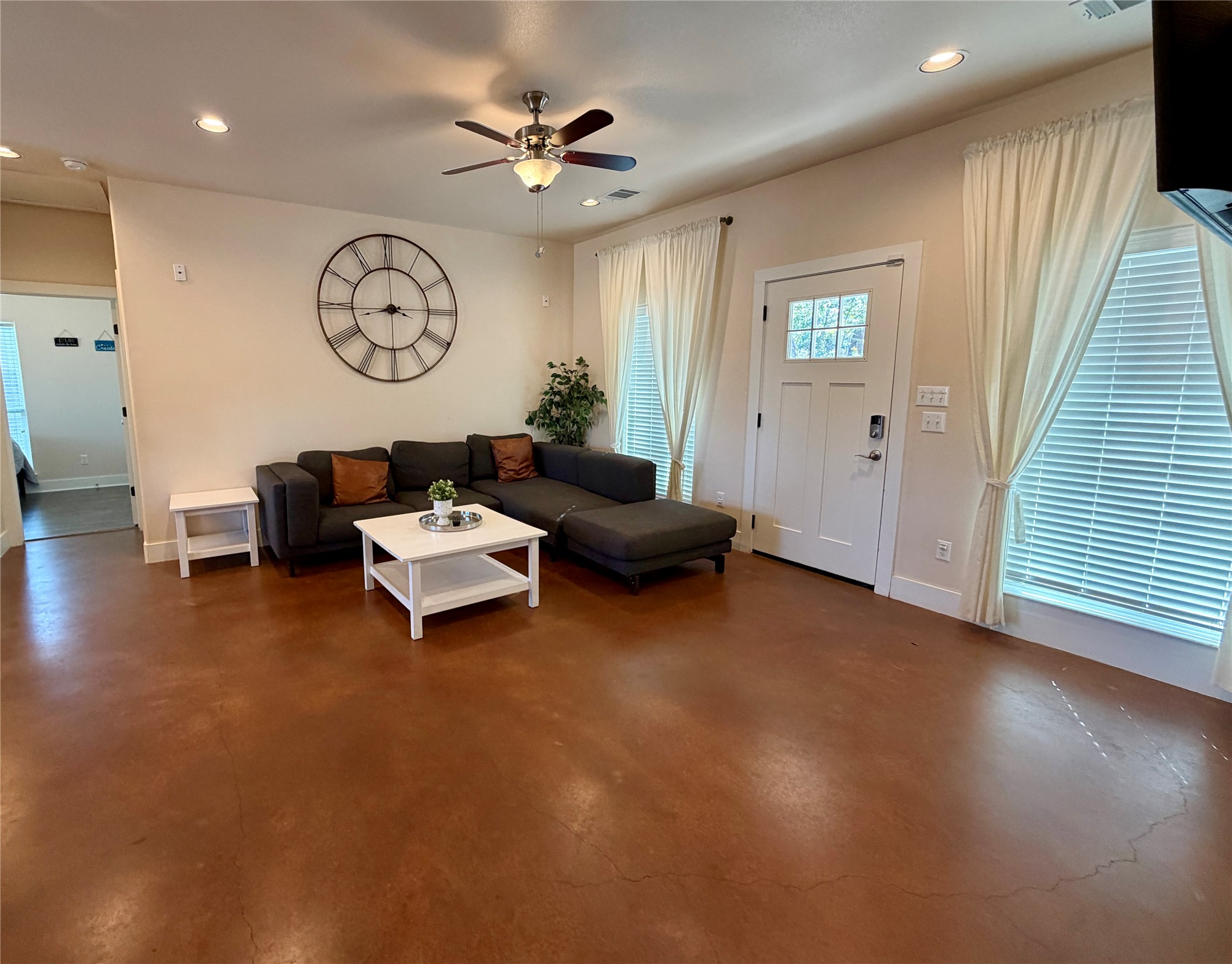 5503 Hiline Road Austin, TX 78734 - Photo 3 of 20 Living area featuring concrete flooring, ceiling fan, and recessed lighting