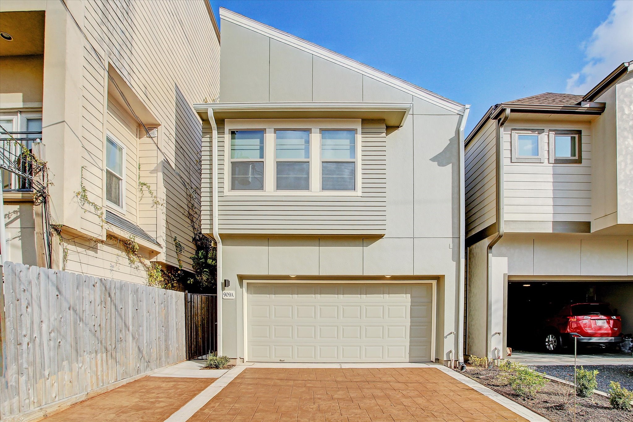 a view of a house with a yard and garage