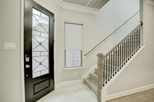 a view of a hallway with wooden floor and windows