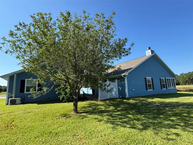 a house view with a garden space