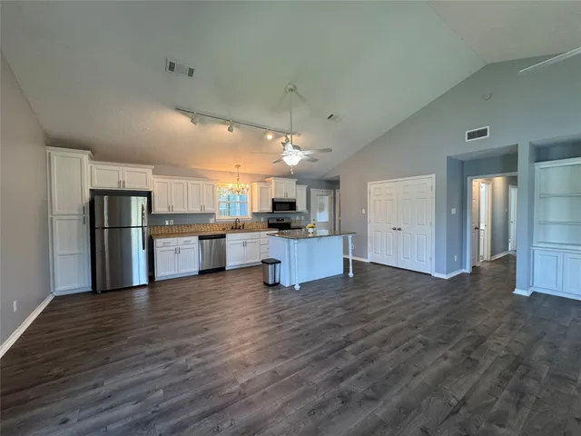 a view of kitchen with wooden floor