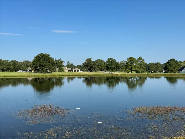 a view of a lake with houses in the background
