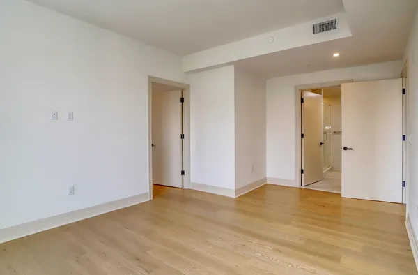 a view of a balcony with wooden floor