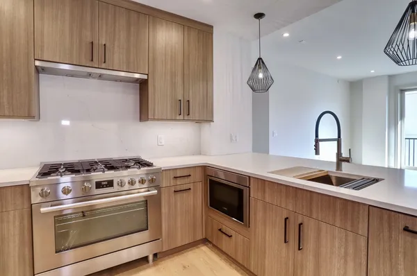 a kitchen with sink and cabinets