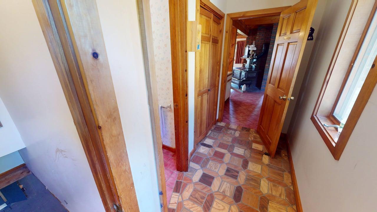 63 Fisher Road Holden, ME 04429 - Photo 3 of 87 63-Fisher-Road-Side-Door-Hallway
