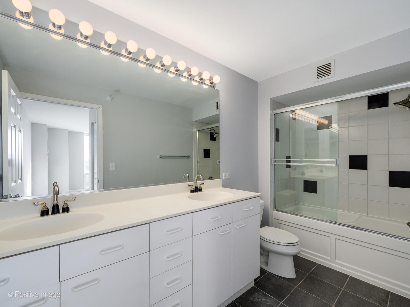 1640 Maple Avenue, Unit 804 Evanston, IL 60201 - Photo 18 of 27 a bathroom with a sink a toilet and shower