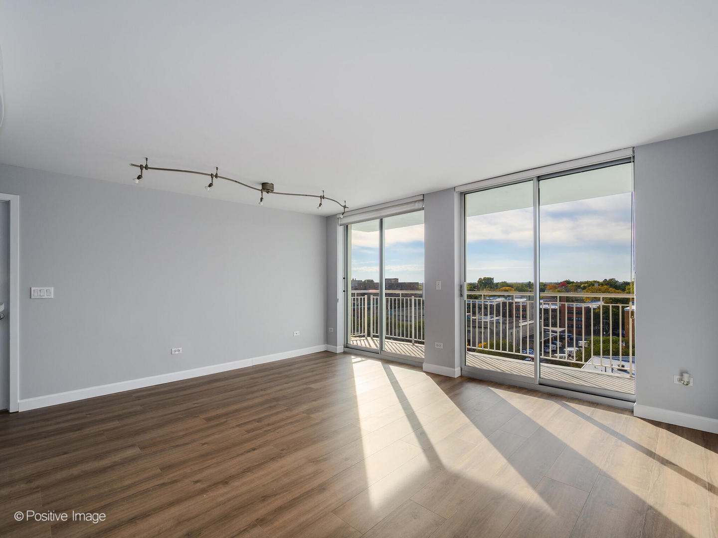 1640 Maple Avenue, Unit 804 Evanston, IL 60201 - Photo 5 of 27 wooden floor in an empty room with a window