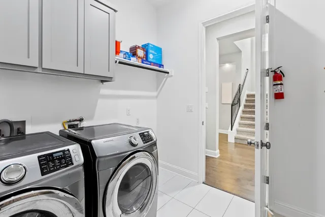 a view of storage and utility room with washer and dryer