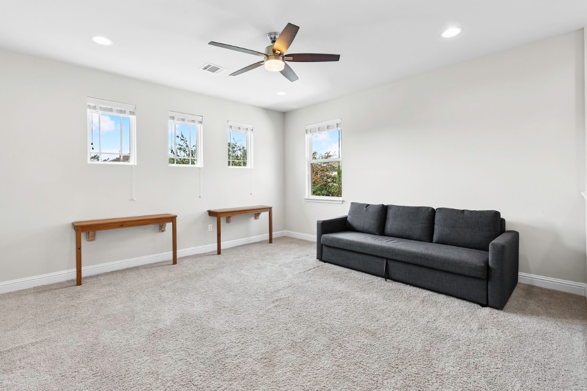 5000 Mandevilla Drive Austin, TX 78739 - Photo 28 of 40 a living room with furniture and a ceiling fan